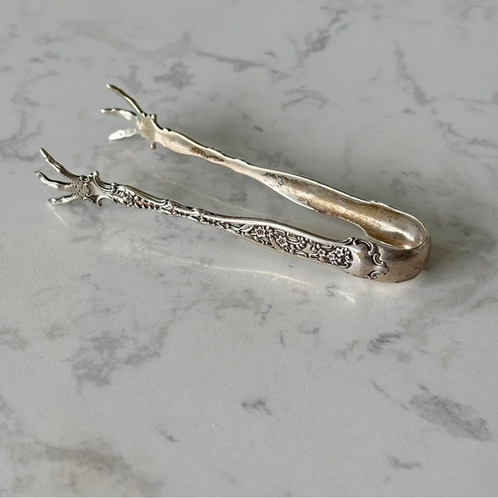 Antique sterling sugar tongs made by Whiting Manufacturing Co